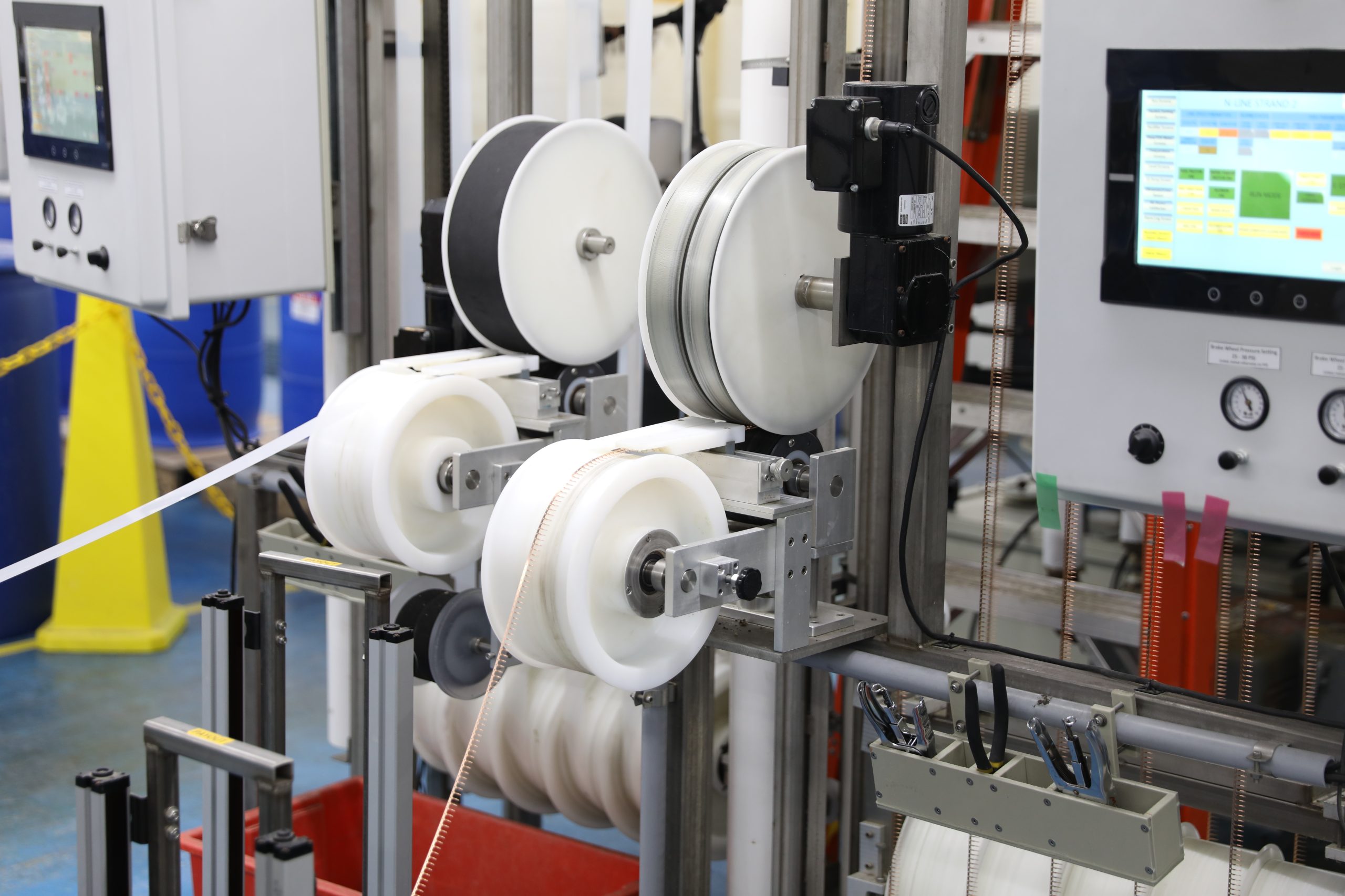 Copper wire reels staged for the reel-to-reel plating process